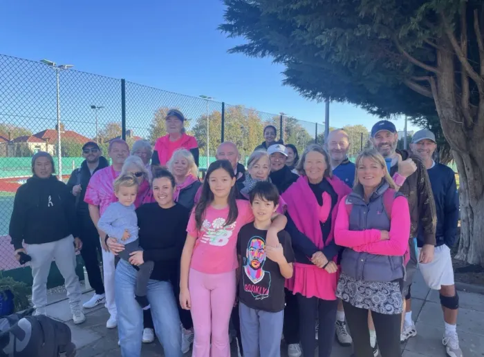 Members and their children dressed in pink for the club's charity day